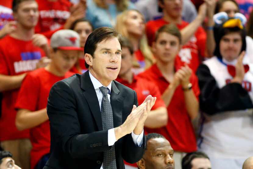 Southern Methodist Mustangs head coach Tim Jankovich  applauds his teams effort against the...