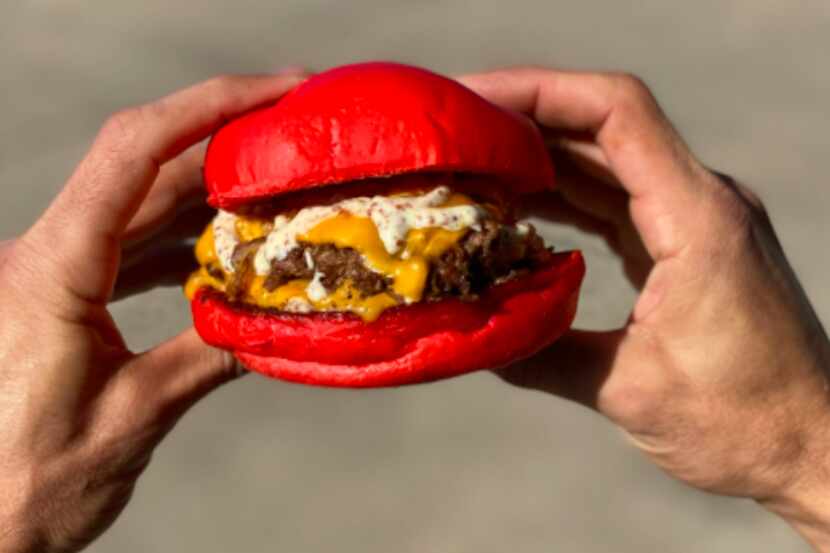 Wulf Burger is a restaurant that sells sandwiches with bright red buns. It opened Jan. 31,...