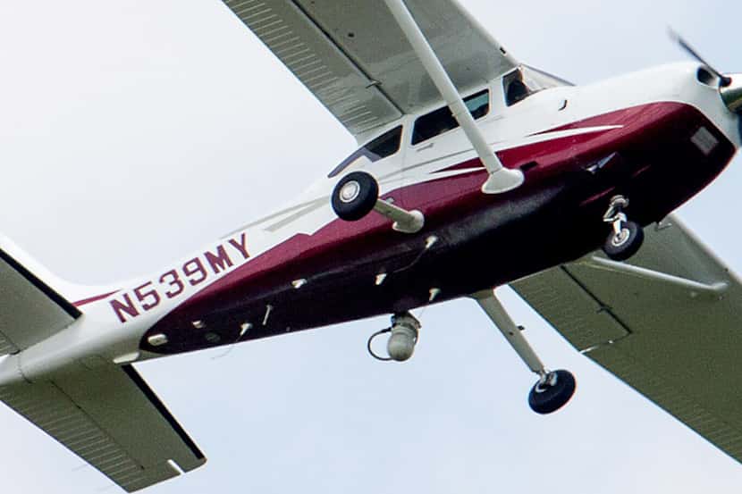A small plane flies near Manassas Regional Airport in Manassas, Va. The plane is part of a...