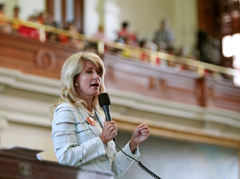  Then-Texas State Sen. Wendy Davis speaks during her 2013 filibuster against a bill...