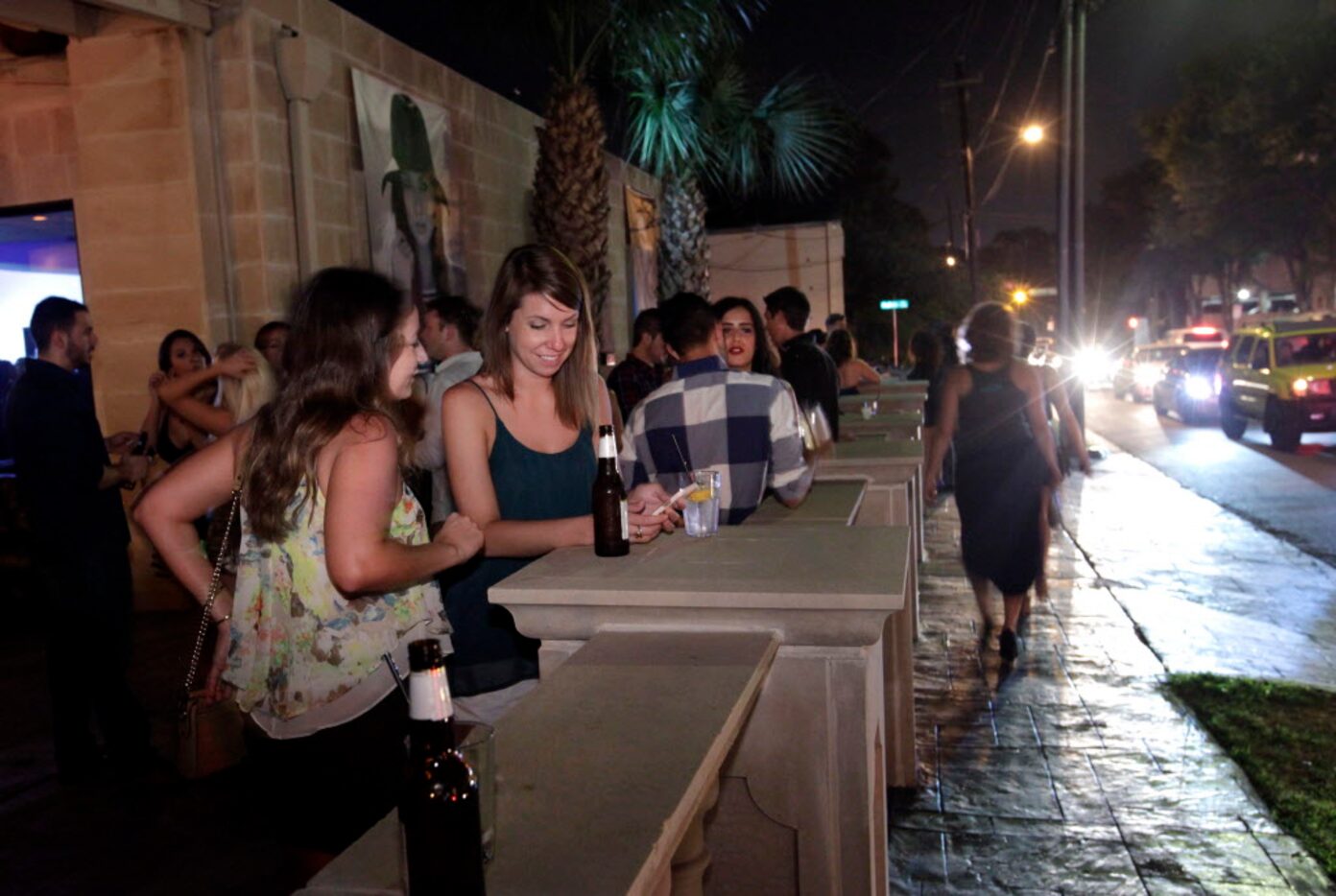 Guests drink and dance at TBD Lounge in Dallas on July 11.