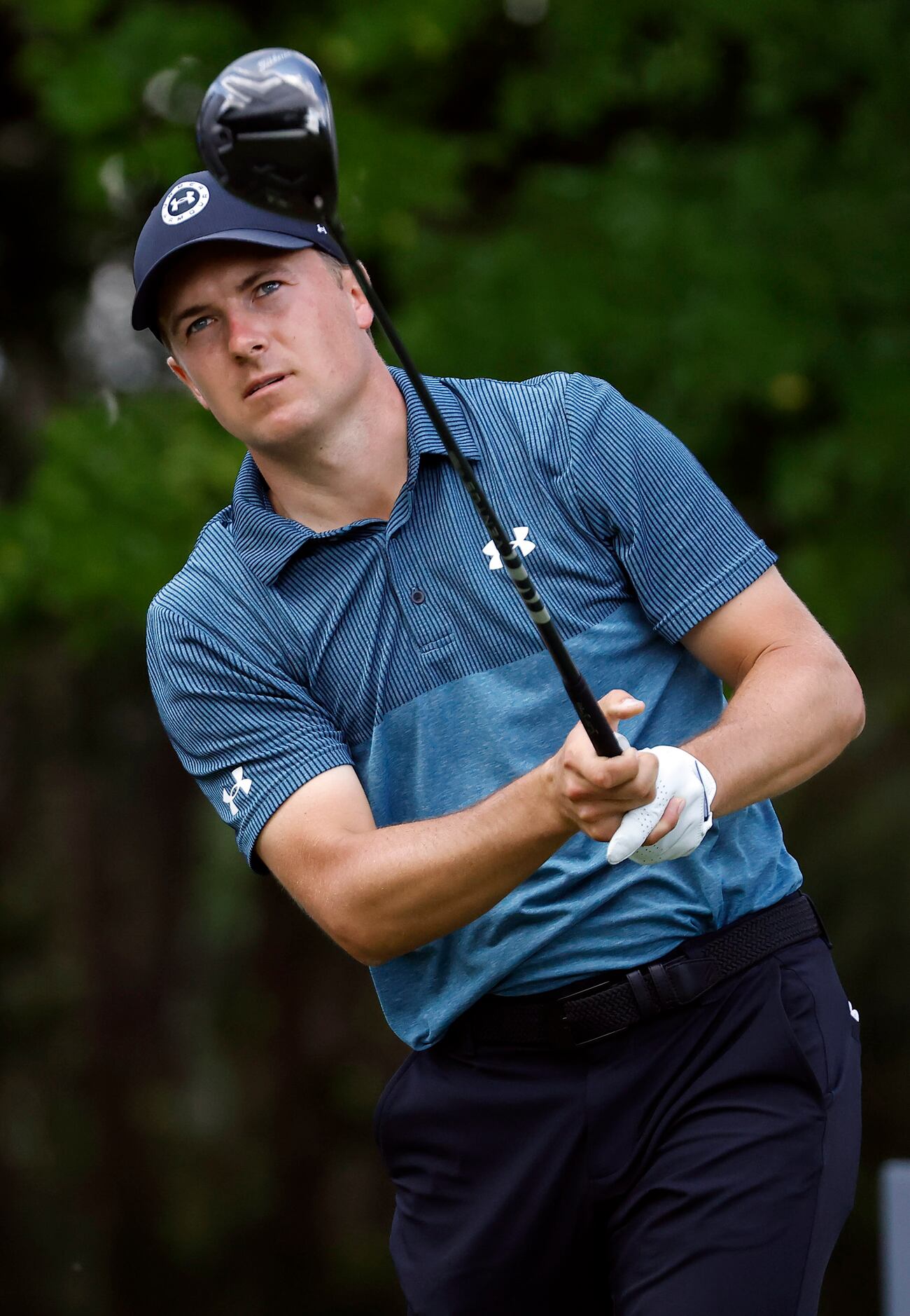 Professional golfer Jordan Spieth follows his tee shot on No. 12 during round three of the...