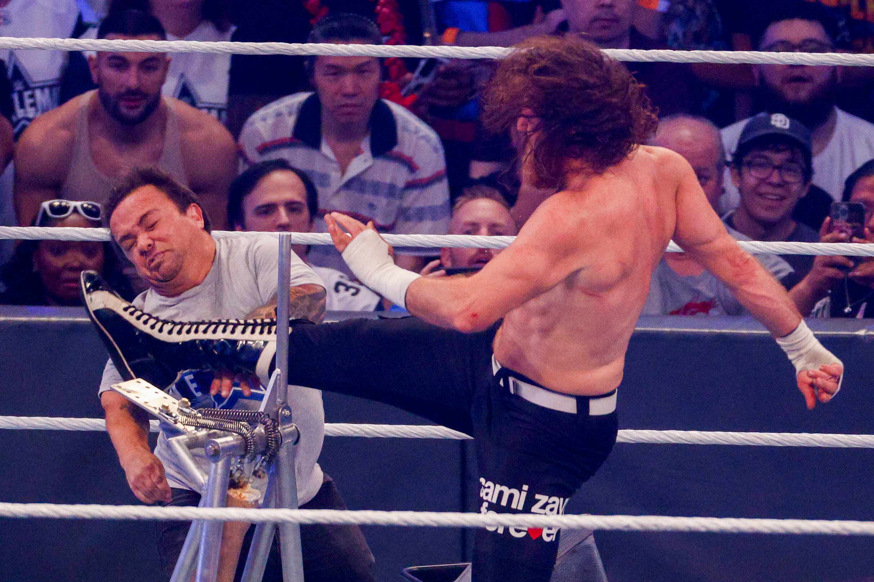 Sami Zayn (right) kicks Wee Man during a match at WrestleMania Sunday at AT&T Stadium in...