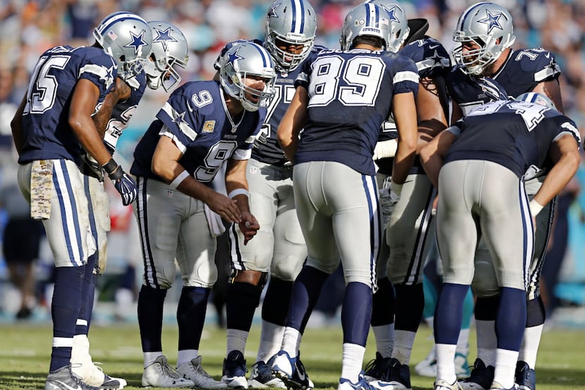 Dallas Cowboys quarterback Tony Romo (9) breaks the huddle during the second half Dallas'...