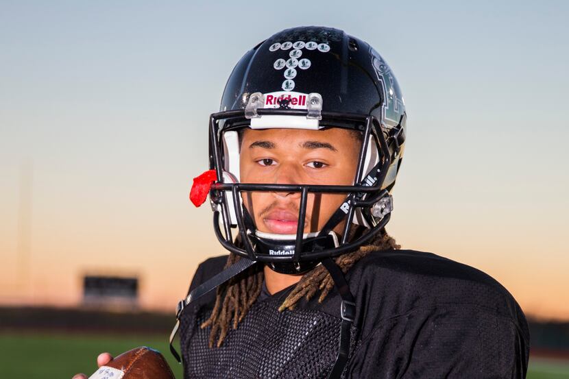 Quarterback Jett Duffey poses for a photo on Wednesday, December 16, 2015 at Mansfield Lake...