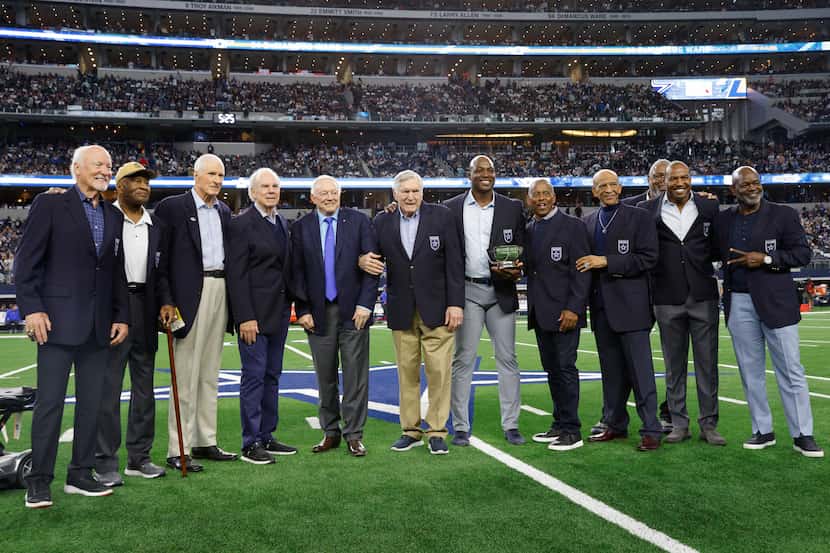 Former Dallas Cowboys defensive end DeMarcus Ware stands alongside fellow Ring of Honor...
