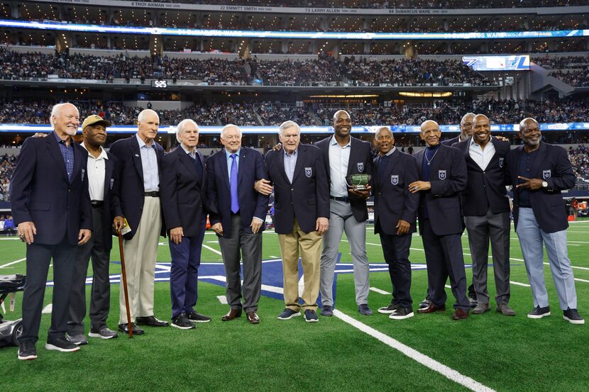 Former Dallas Cowboys defensive end DeMarcus Ware stands alongside fellow Ring of Honor...