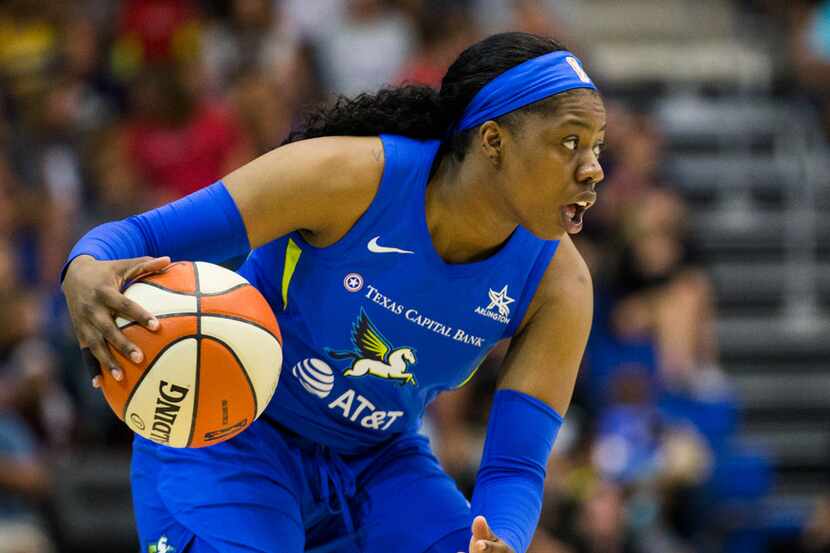 Dallas Wings guard Arike Ogunbowale (24) looks for a pass during the second quarter of a...