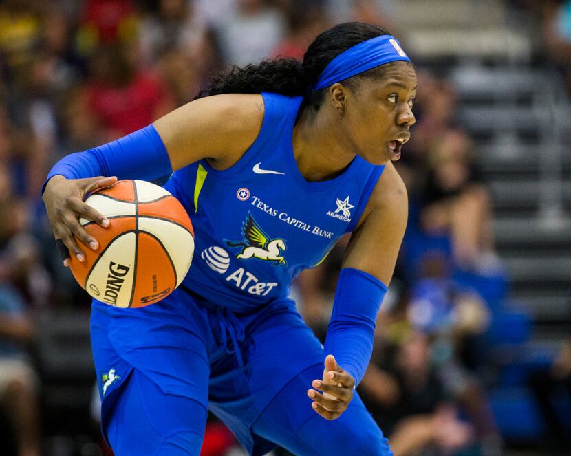 Dallas Wings guard Arike Ogunbowale (24) looks for a pass during the second quarter of a...