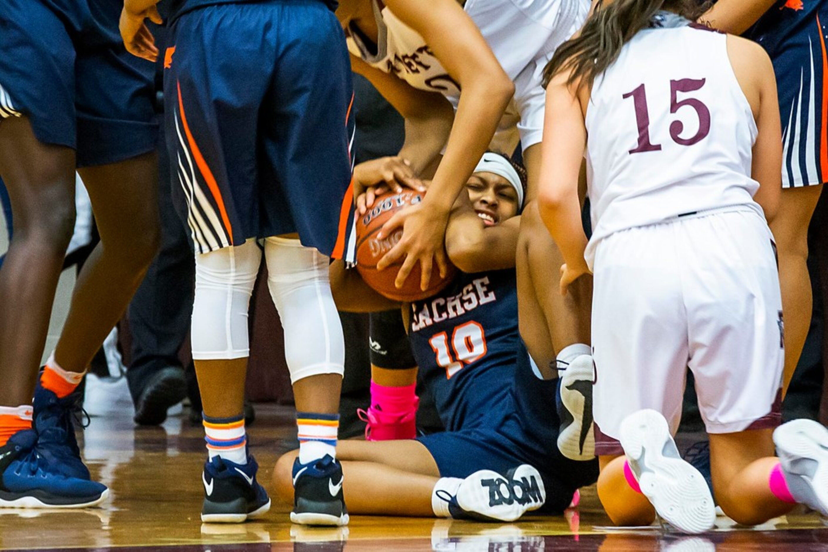 Sachse guard Kayla Demus (10) fights for a loose ball against Rowlett guards Nevaeh Zavala...