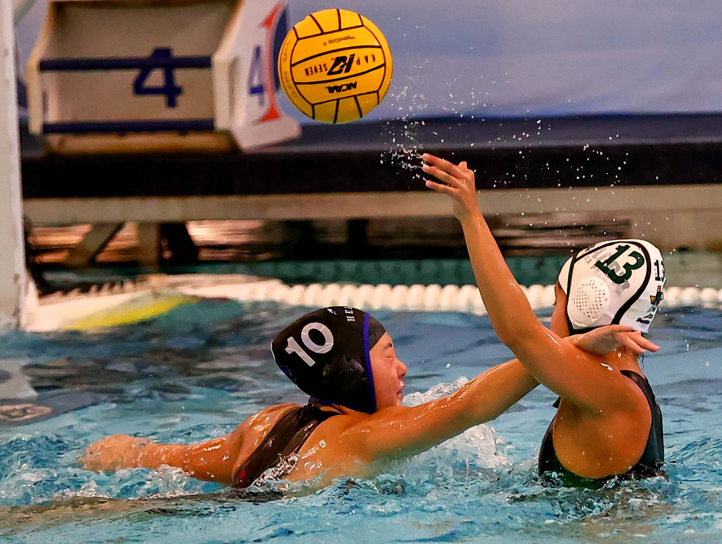 Southlake Carroll's Ella Le (13) tries to get off a shot over Hebron's Mollie Cho (10) in...