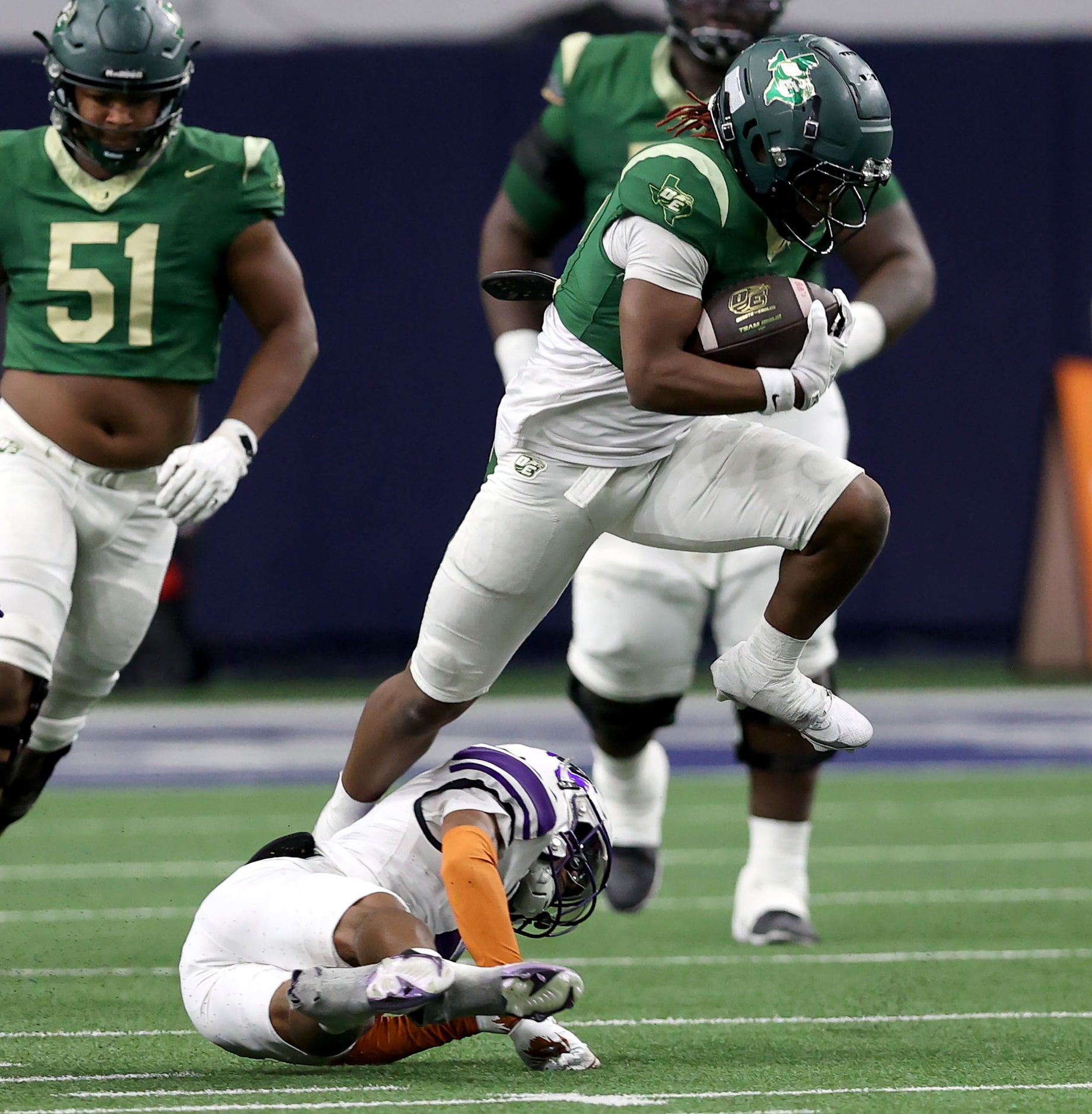 DeSoto running back SaRod Baker (right) goes over Willis safety Jermaine Bishop Jr for a...