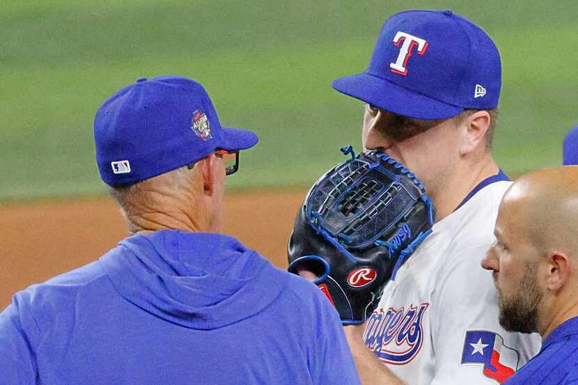Texas Rangers pitcher Josh Sborz (66), right, talks with Texas Rangers pitching coach Mike...