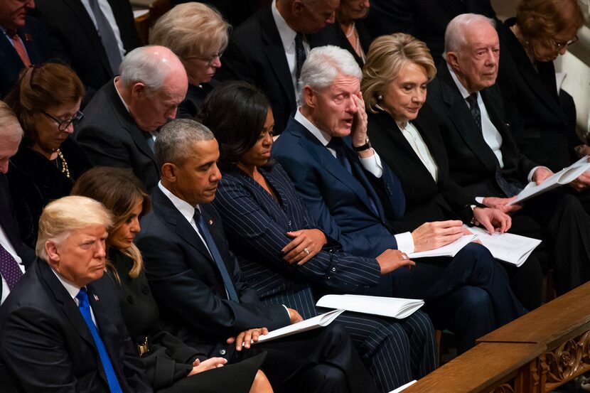 Former President Bill Clinton wipes away tears as Rev. Russel Levenson of St. Martin's...