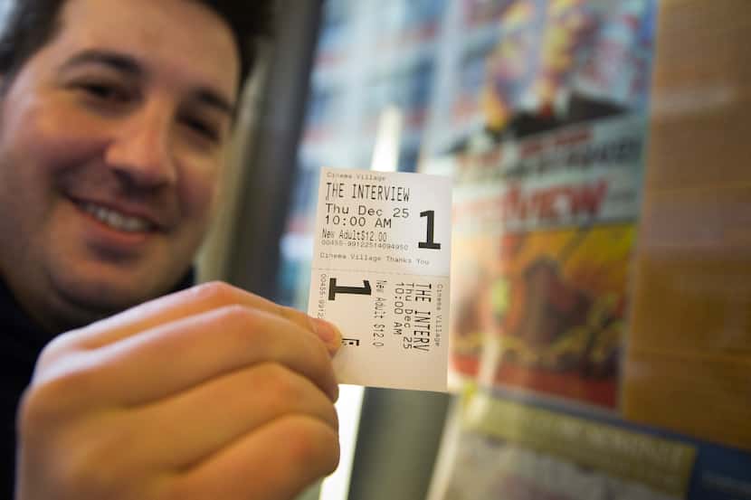 Derek Karpel triumphantly held up his ticket to "The Interview" before a Christmas Day...