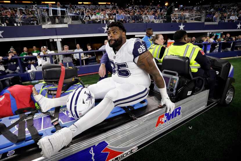 Dallas Cowboys defensive tackle Johnathan Hankins (95) was carted off the field during the...