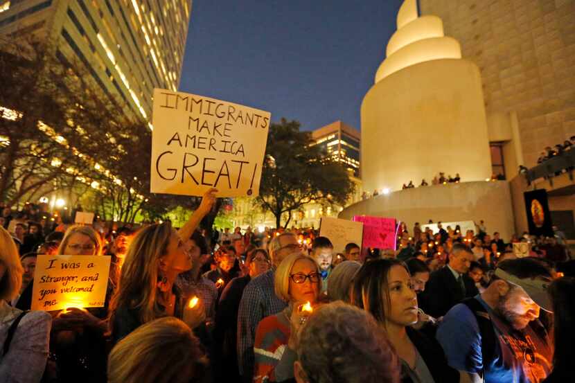 Hundreds protest at a vigil for refugees on Monday, Jan. 30, 2017, in Dallas. (Rodger...