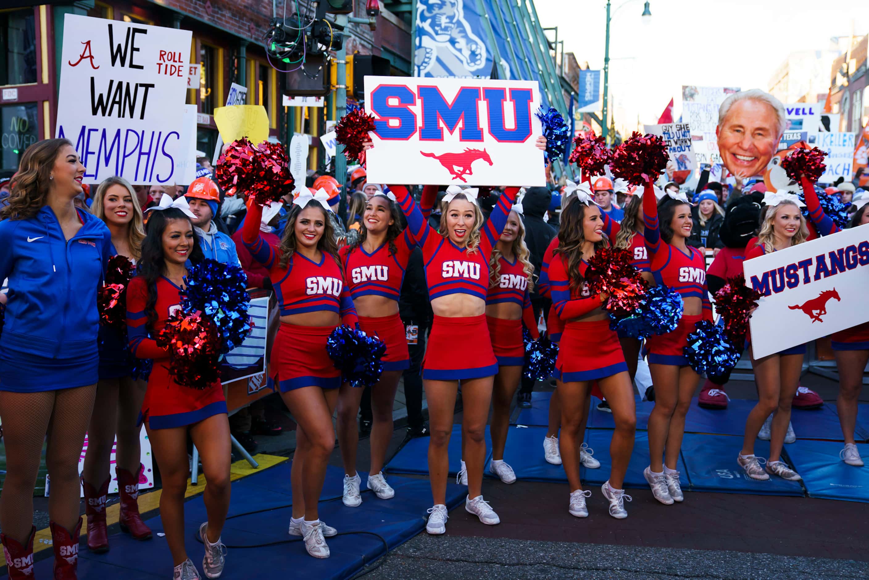 SMU cheerleaders yell on the set of ESPN College GameDay before an NCAA football game...