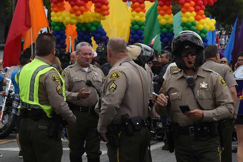 
Police and sheriff's deputies provide security during the 2016 Gay Pride Parade in Los...