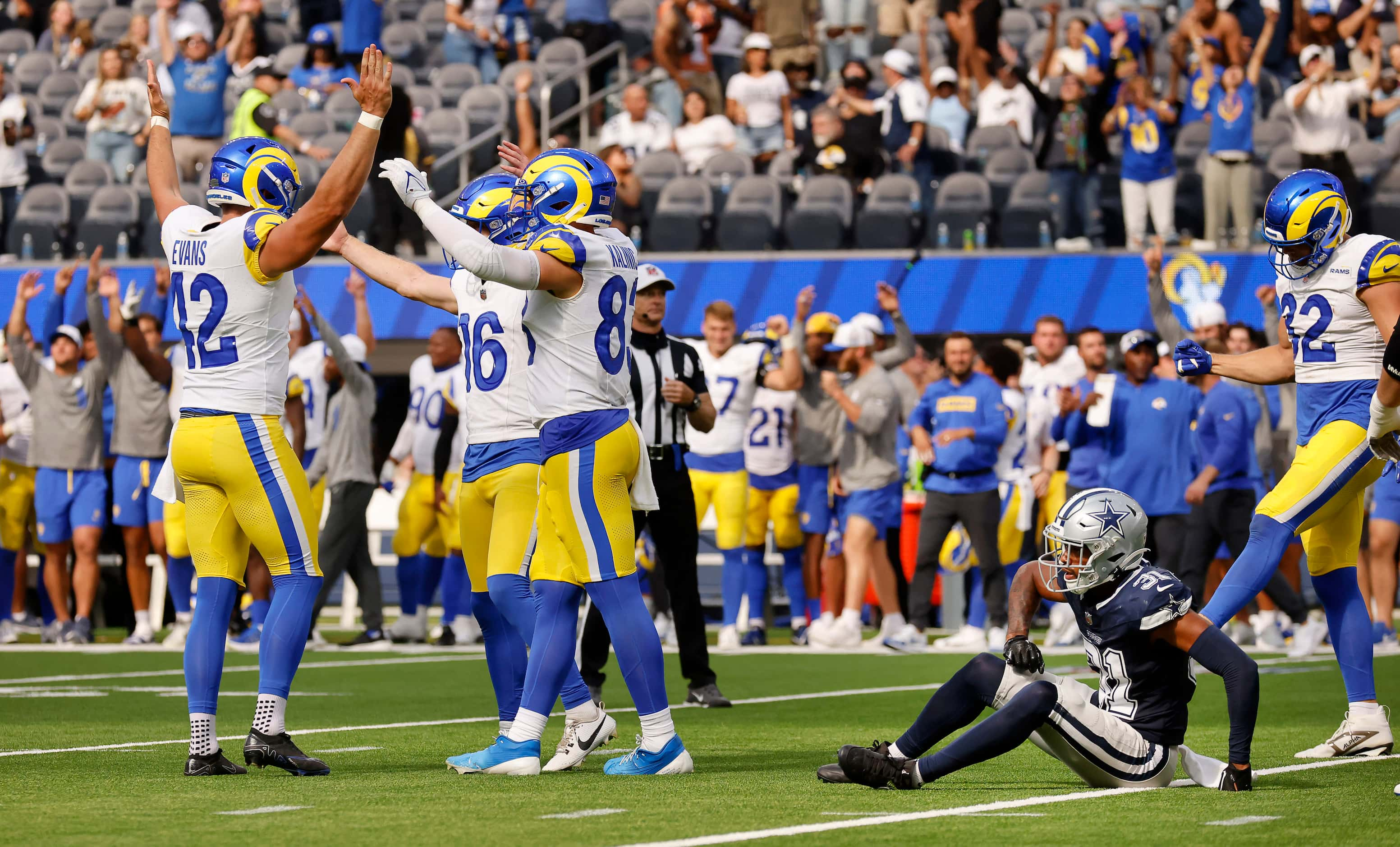 Los Angeles Rams place kicker Joshua Karty (16) and his teammates celebrate their win over...