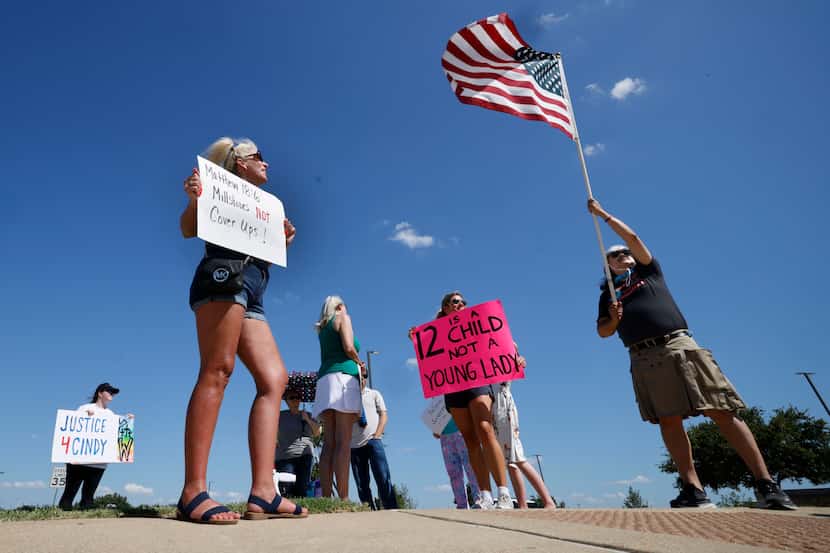 A group of protesters including Lori Jordan-Rice of Saginaw, Texas, (second from left) and...