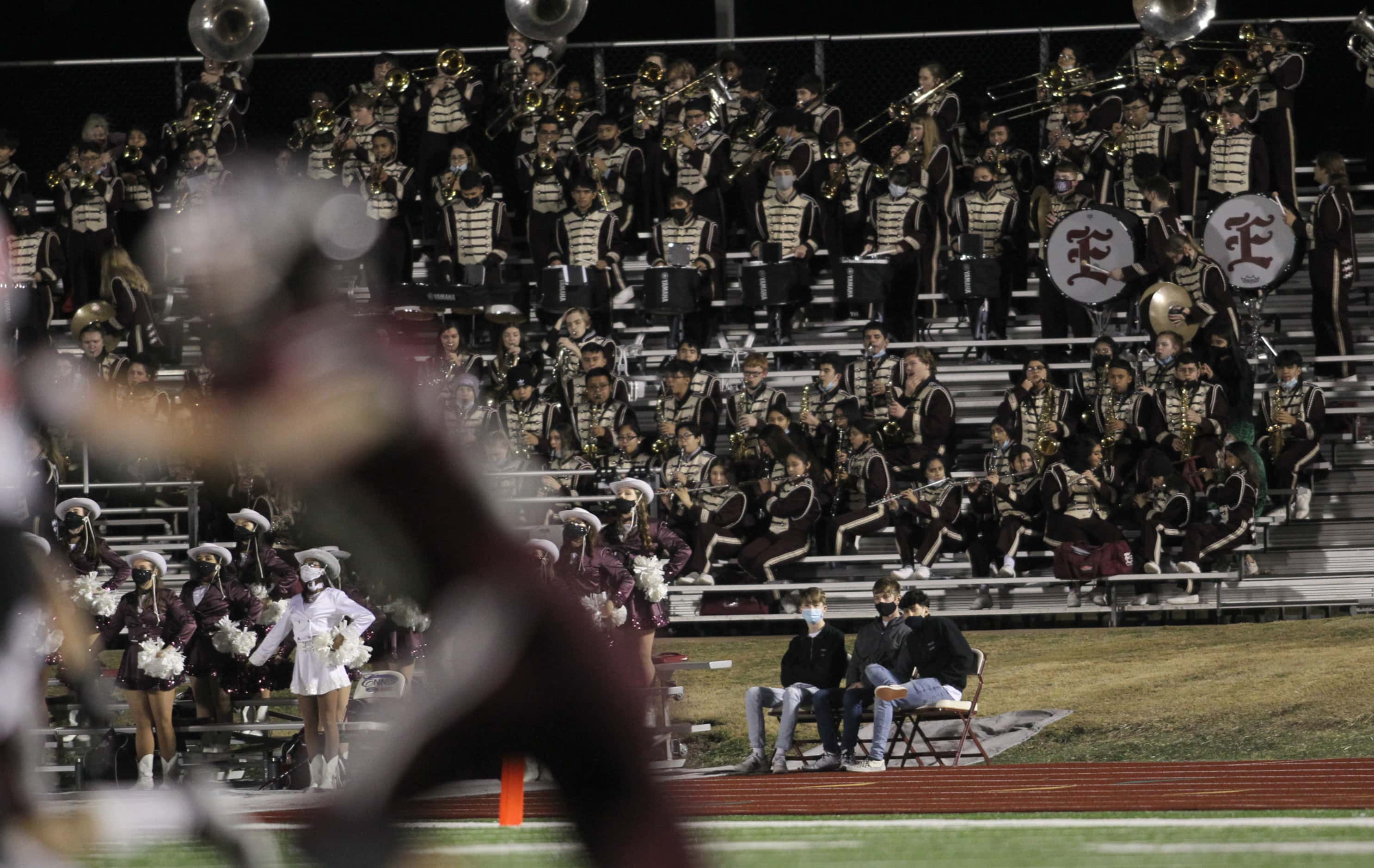 Members of the Ennis band and drill team perform during the second half kickoff of the game...
