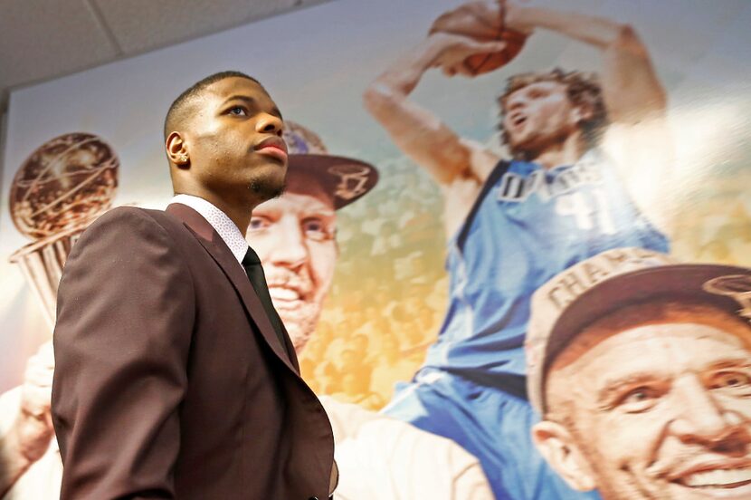 Mavericks first round pick Dennis Smith Jr. arrives at a press conference at American...