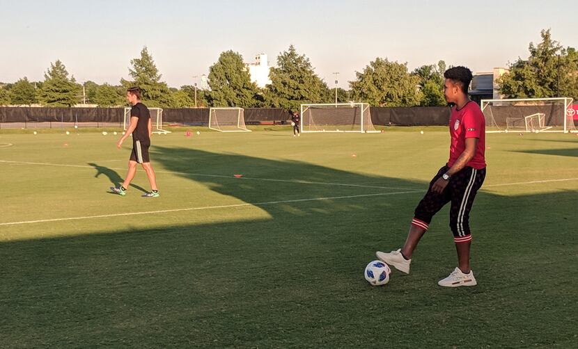 Weston McKinnie (right in red US Soccer top) watches FC Dallas trianing. (6-21-18)