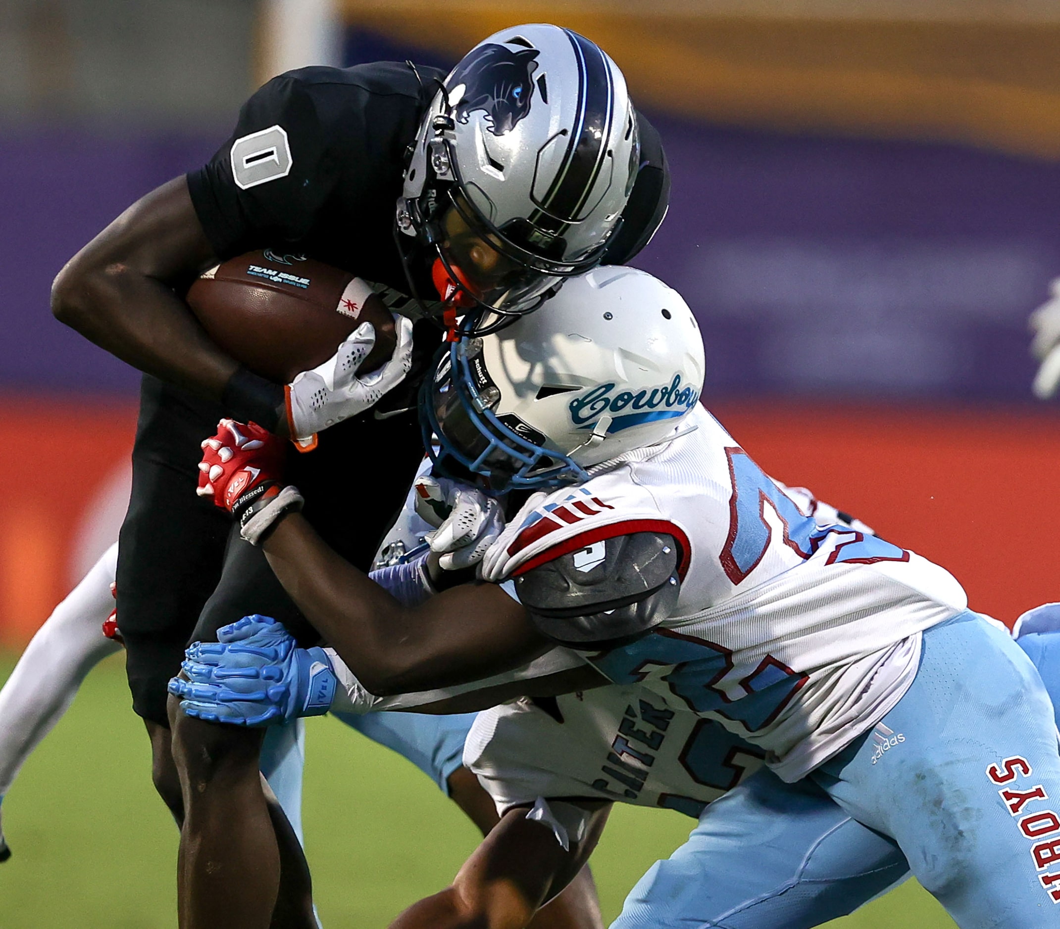 Frisco Panther Creek wide receiver Jalen Lott (0) gets hit hard by Dallas Carter defensive...