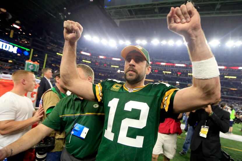 Green Bay Packers quarterback Aaron Rodgers (12) celebrates after winning an NFL divisional...