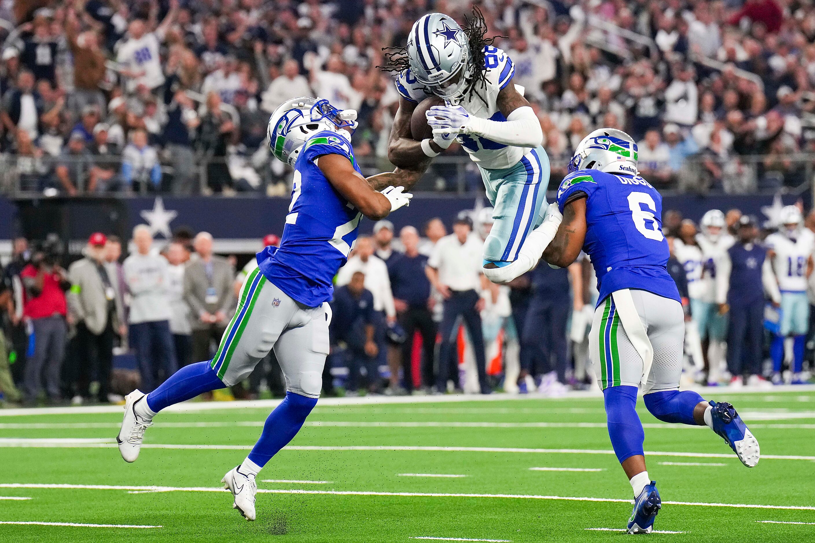 Dallas Cowboys wide receiver CeeDee Lamb (88) can’t hurdle his way in to the end zone as...