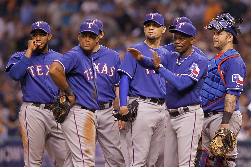 Manager Ron Washington (38) signals the bullpen during Game Three of the American League...