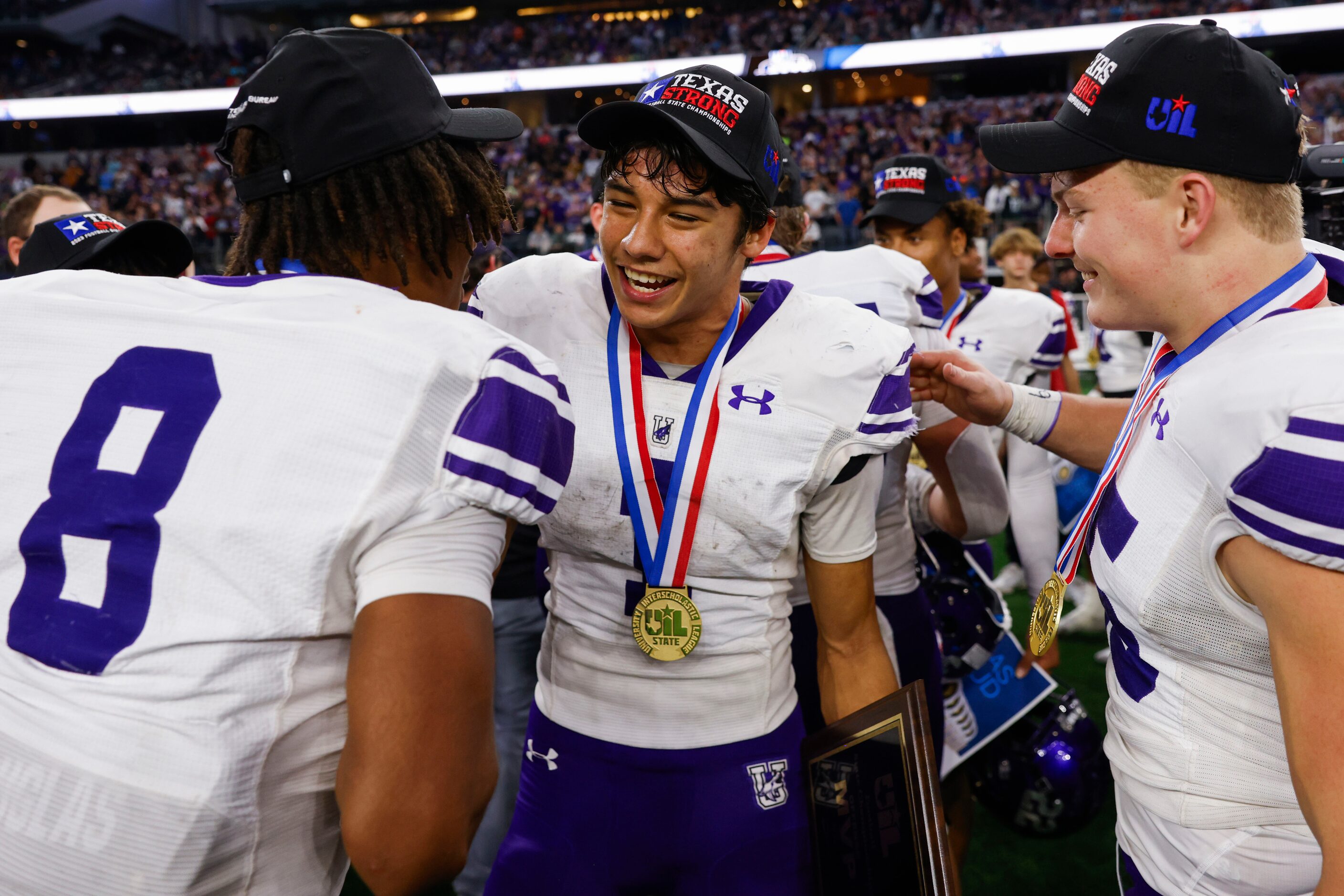 Anna High’s QB Ziondre Williams (left) and Cash Williams (right) congratulate Edward Chumley...