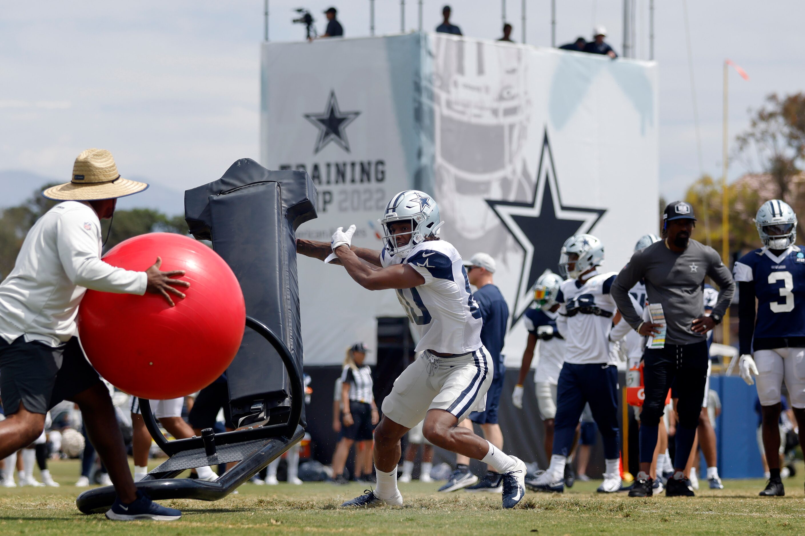 Dallas Cowboys wide receiver Brandon Smith (80)  pushes off the blocking sled before...