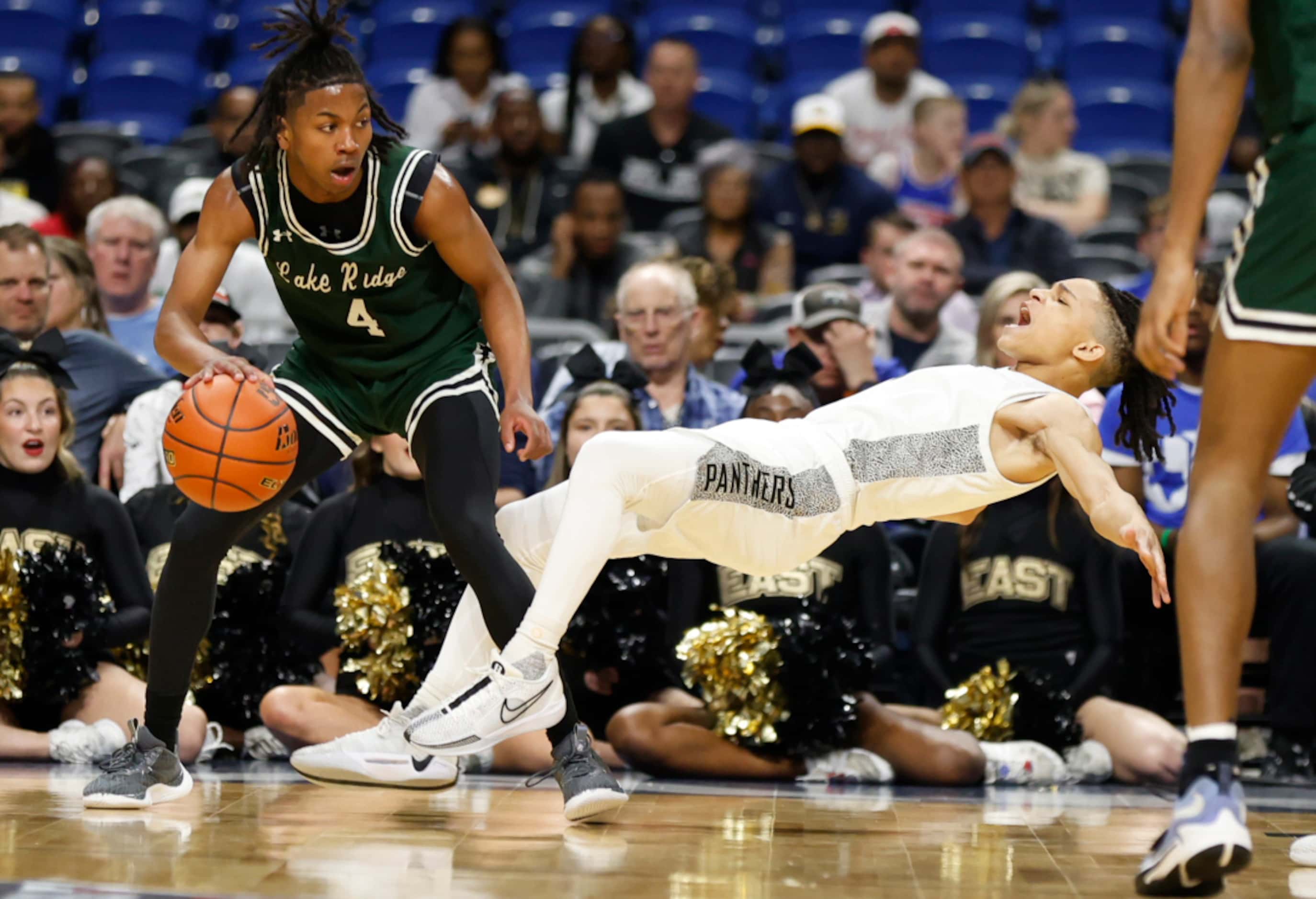 Plano East's Rachard Angton (1) tries to draw a charge from Mansfield Lake Ridge's Amir...