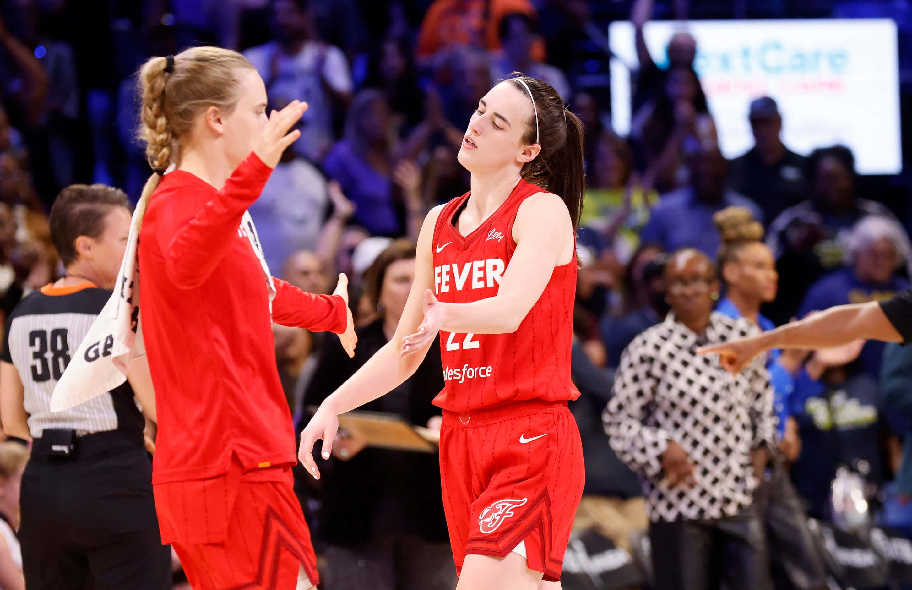 Indiana Fever guard Caitlin Clark (22) reacts after she turned the ball over in the closing...