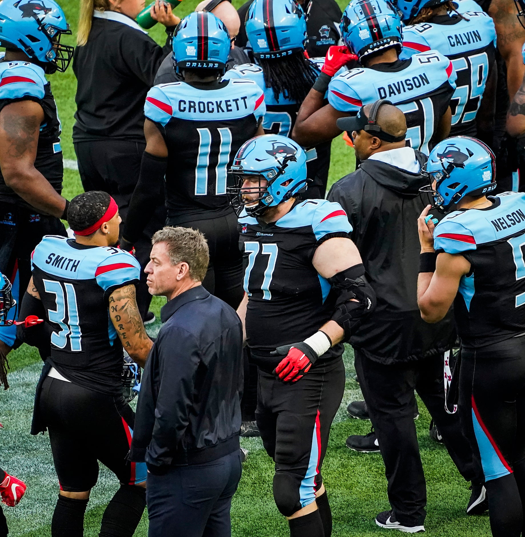 Troy Aikman watches the game from the Dallas Renegades bench during the first half of an XFL...