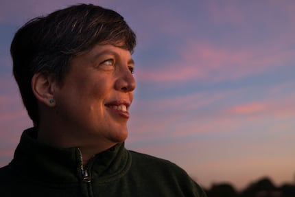 Amy Lewis Hofland poses for a portrait during a recent sunrise over White Rock Lake in Dallas.