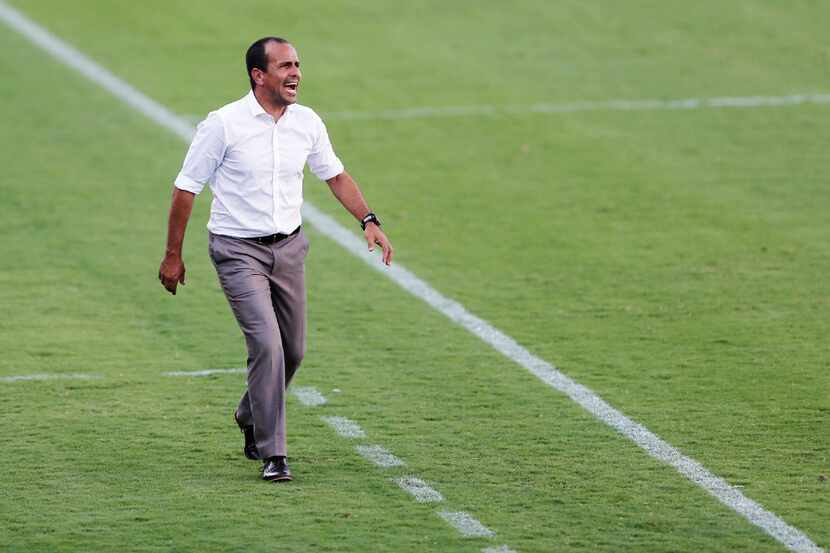 FILE - FC Dallas head coach Oscar Pareja patrols the sideline during the first half of a...