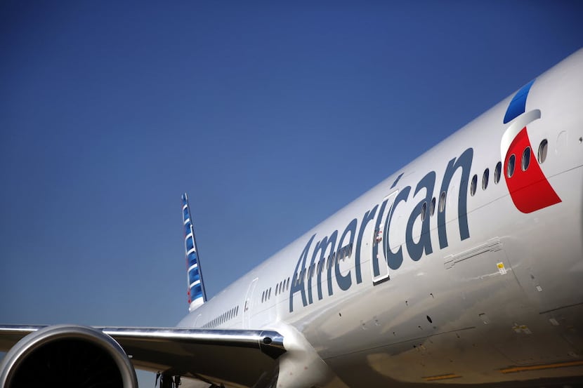 The freshly painted American Airlines 777 bears the new logo and look at Terminal D, where...