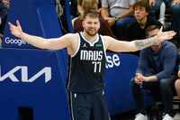 Dallas Mavericks guard Luka Doncic (77) reacts during the second half of Game 3 of an NBA...