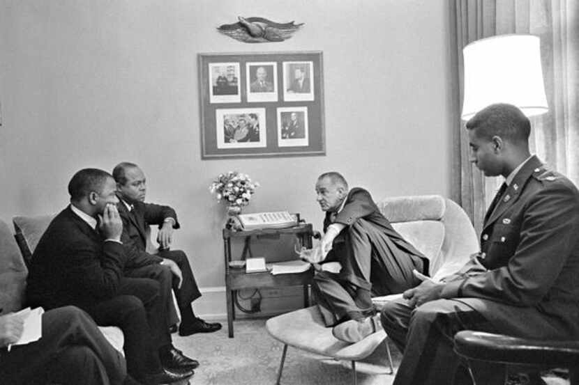 
President Lyndon Johnson met with (from left) John Lewis, James Farmer and Hugh Robinson at...