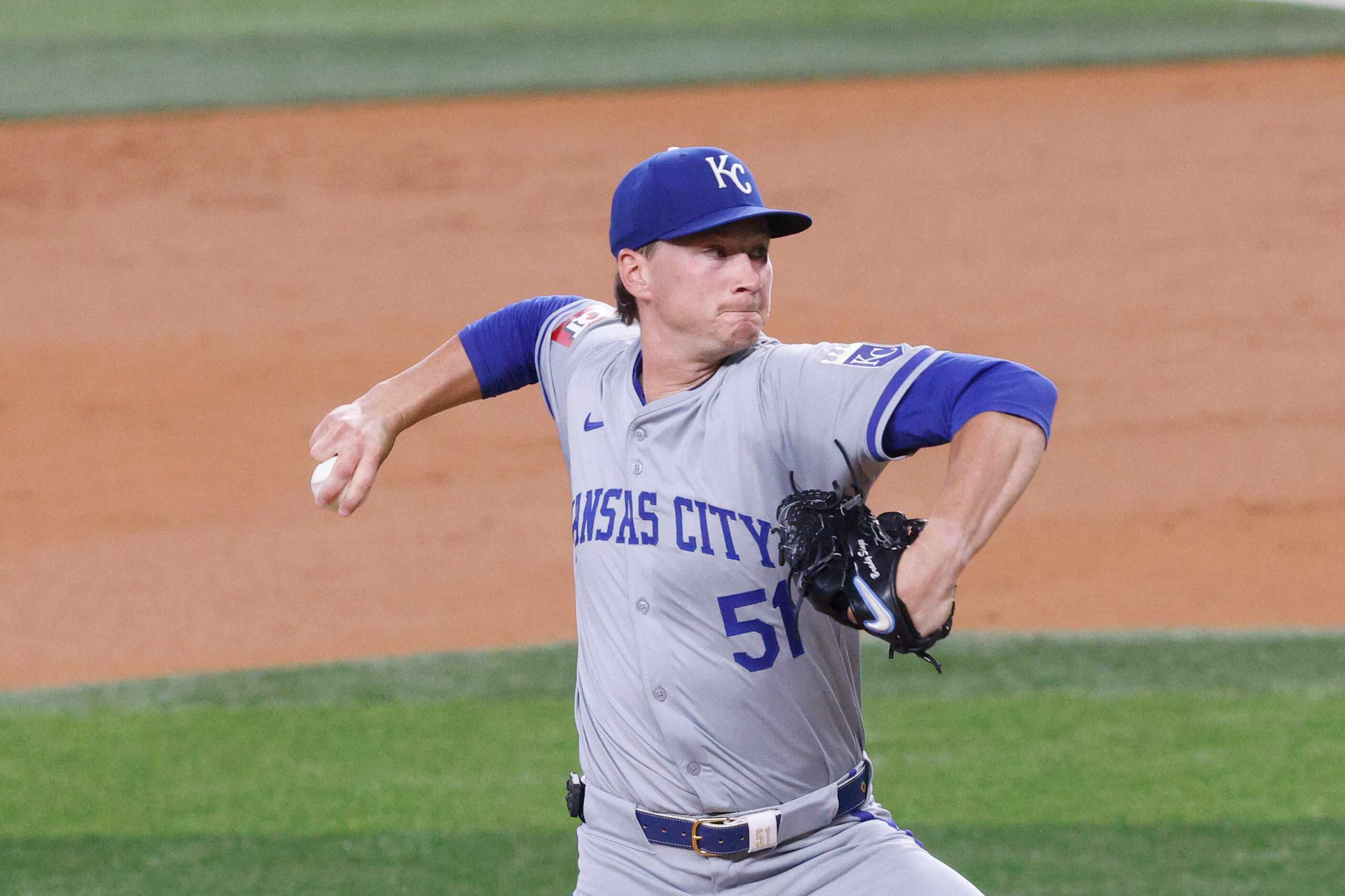 Kansas City Royals pitcher Brady Singer (51) delivers during the second inning of a baseball...