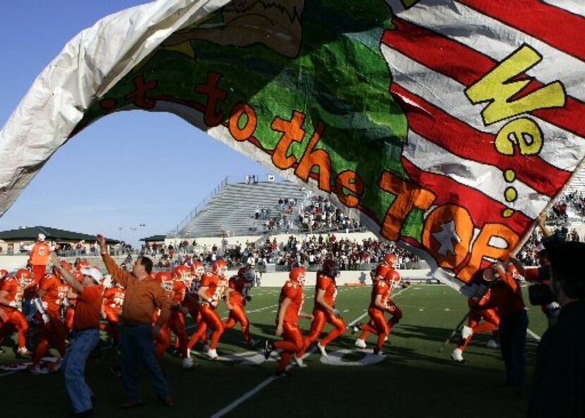 ORG XMIT: *S18F4EBE1* High winds made the banner difficult to hold as the Celina Bobcats...