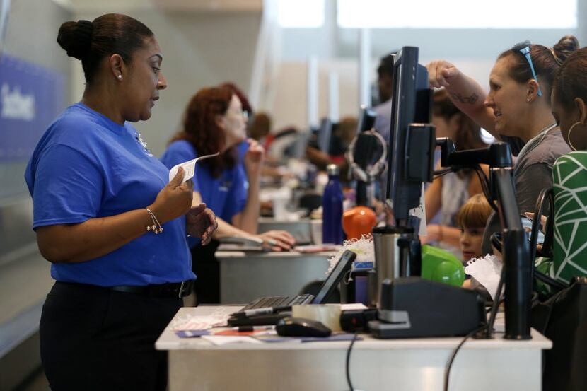 Sharlene, a customer service agent for Southwest Airlines, checked in a passenger at the...
