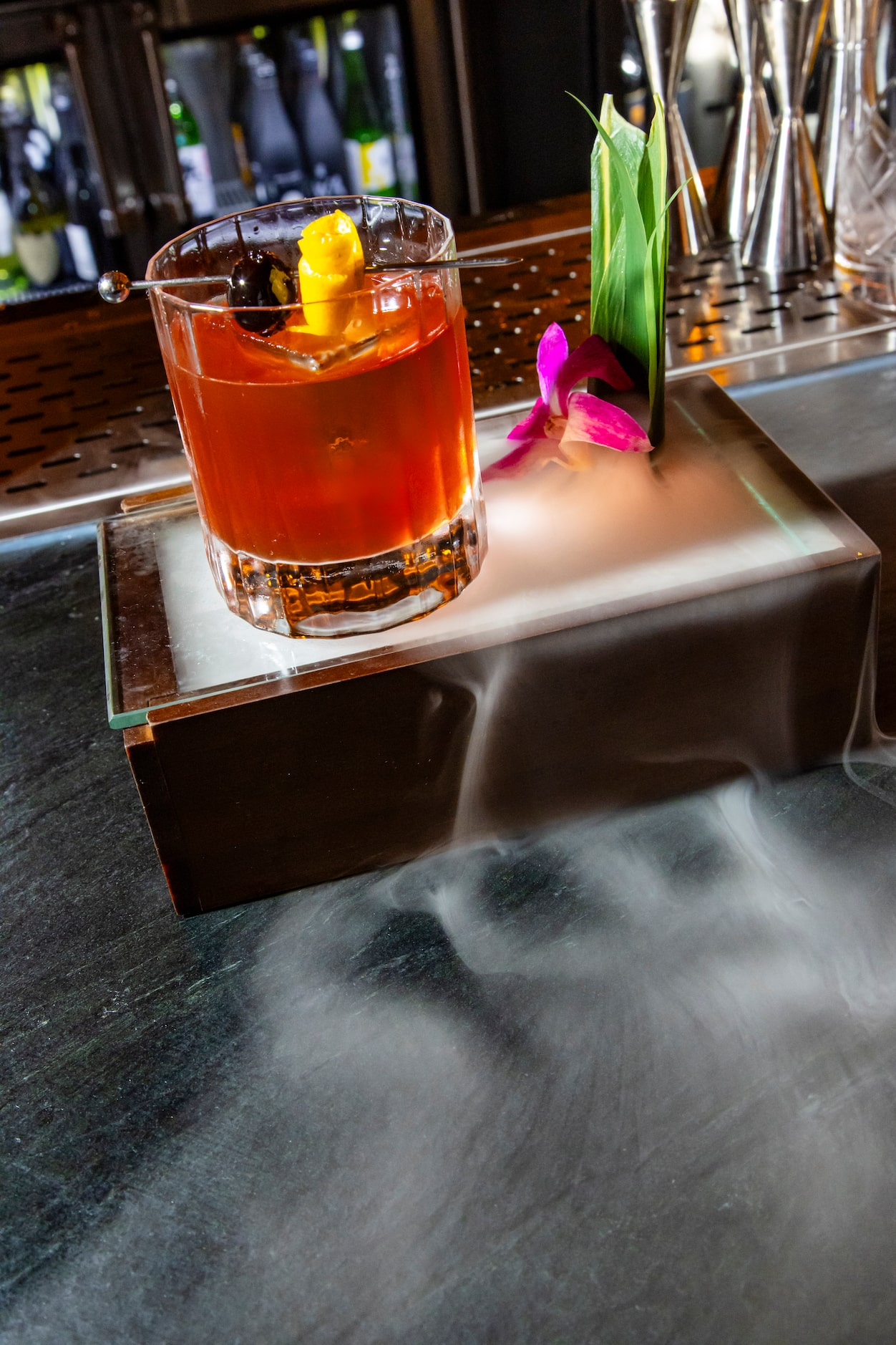 The Duck Old Fashioned froths with smoke at Regines in Dallas.