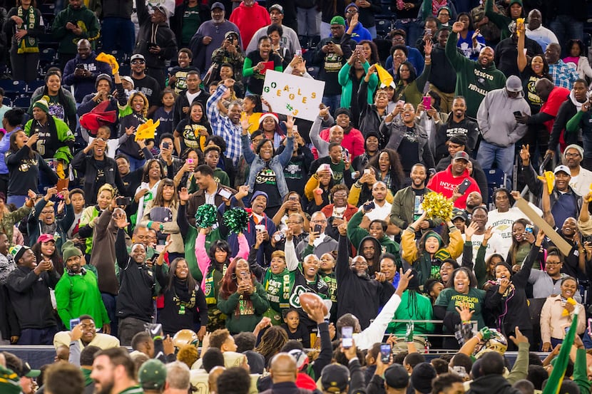 DeSoto fans cheer their team after a victory over Klein Collins in a UIL Class 6A Division...