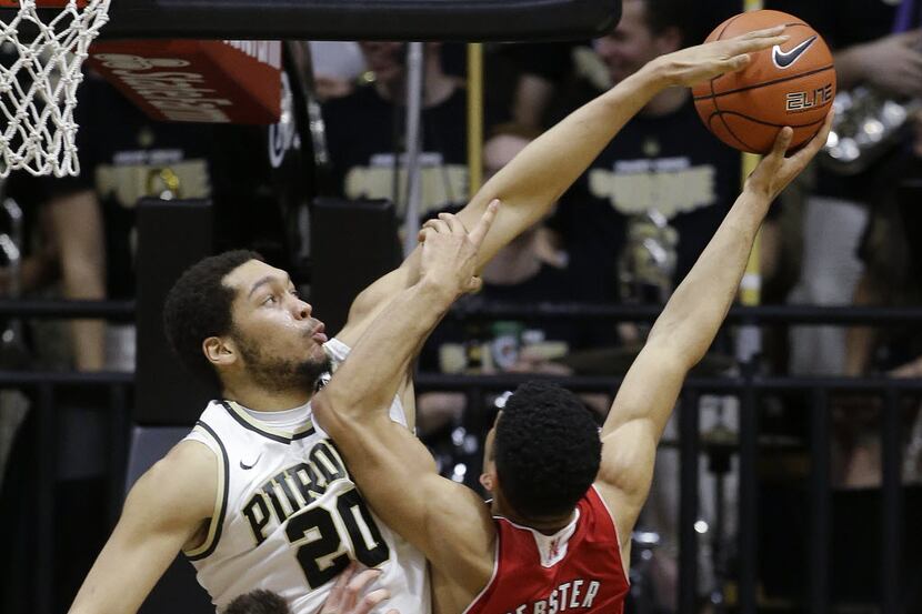 Purdue's A.J. Hammons (20) fouls Nebraska's Tai Webster (0) as Webster goes up for a shot...