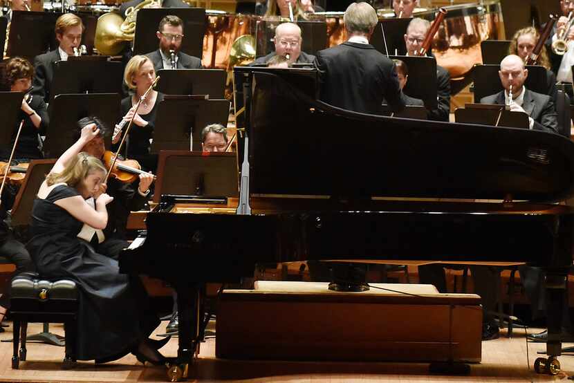David Robertson, right, conducts the Dallas Symphony Orchestra with pianist Orli Shaham as...