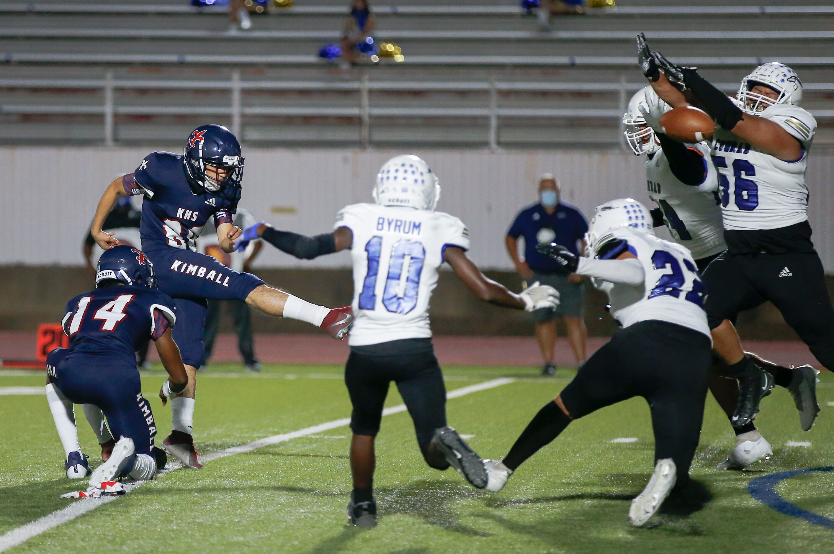 Conrad senior Yonatan Torres (56) blocks a extra point attempt by Kimball junior kicker...